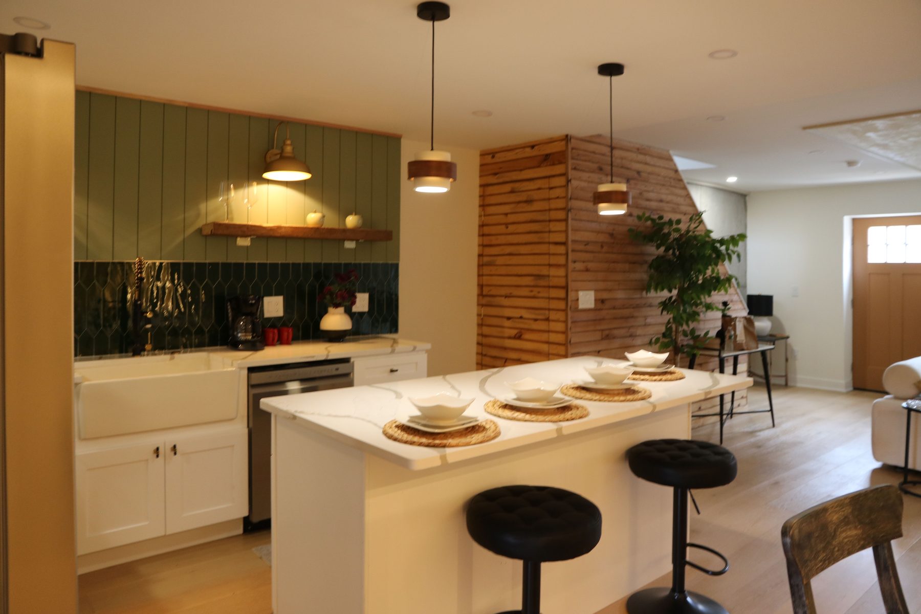 Completed kitchen install with stone backsplash and cabinetry detail