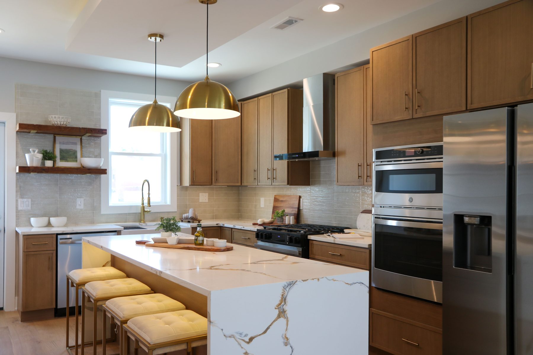 Modern kitchen featuring stone counters and full backsplash