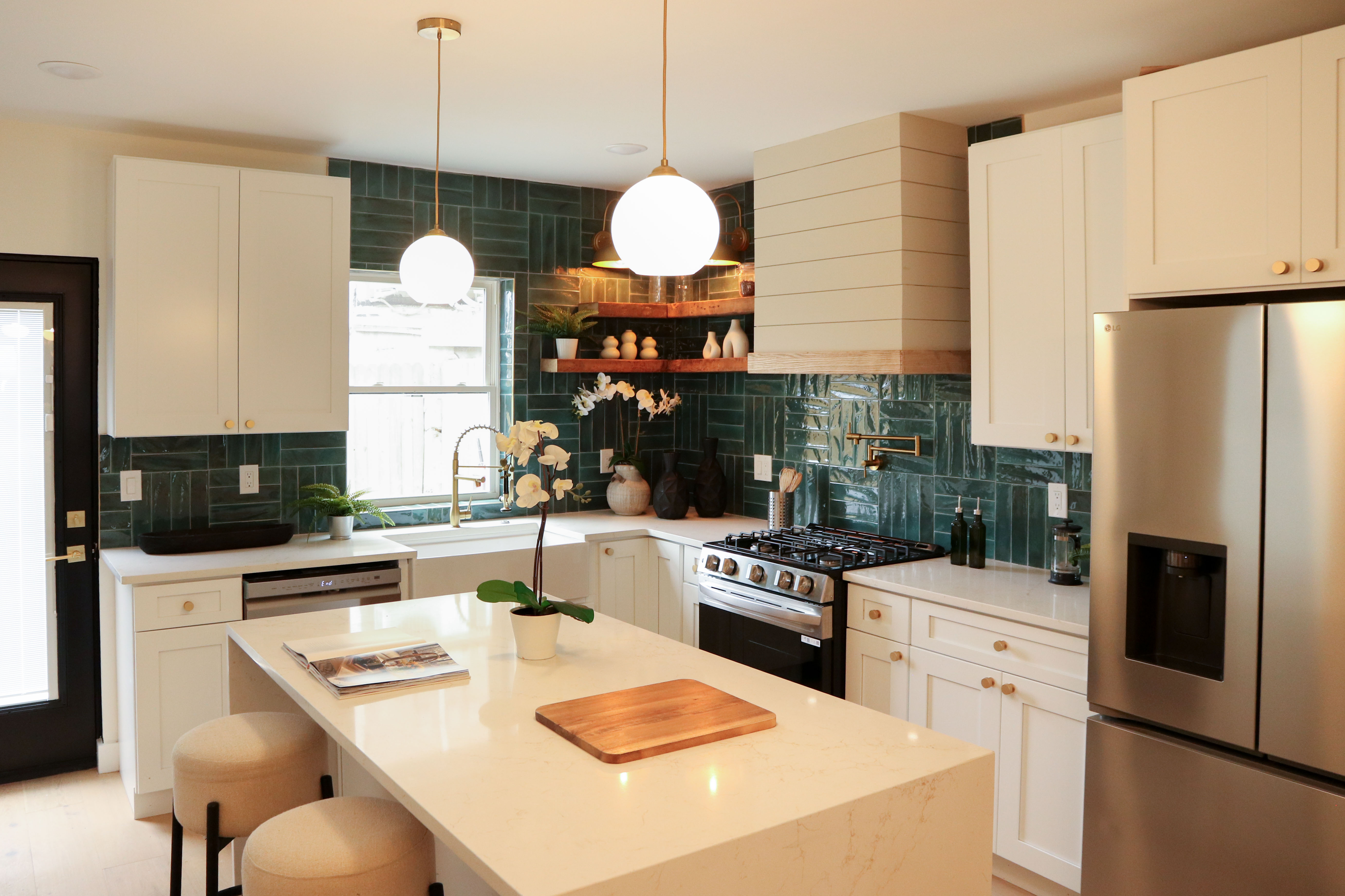 Modern kitchen with granite countertops and custom white cabinetry