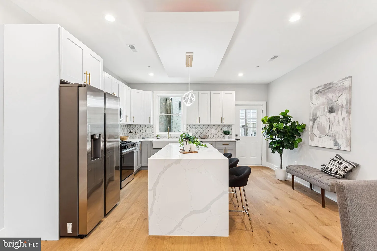 Master bath with double vanity and marble countertop