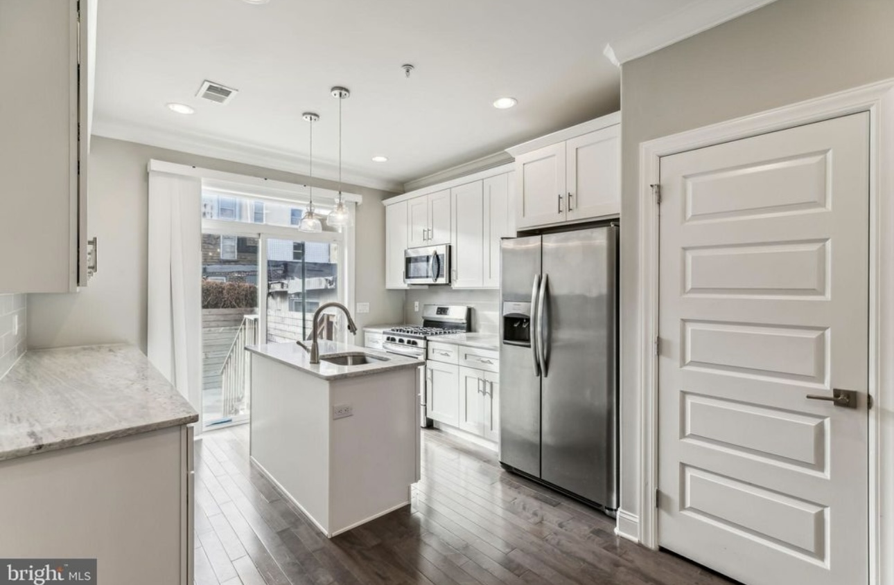 Kitchen cabinetry layout with island and counter seating