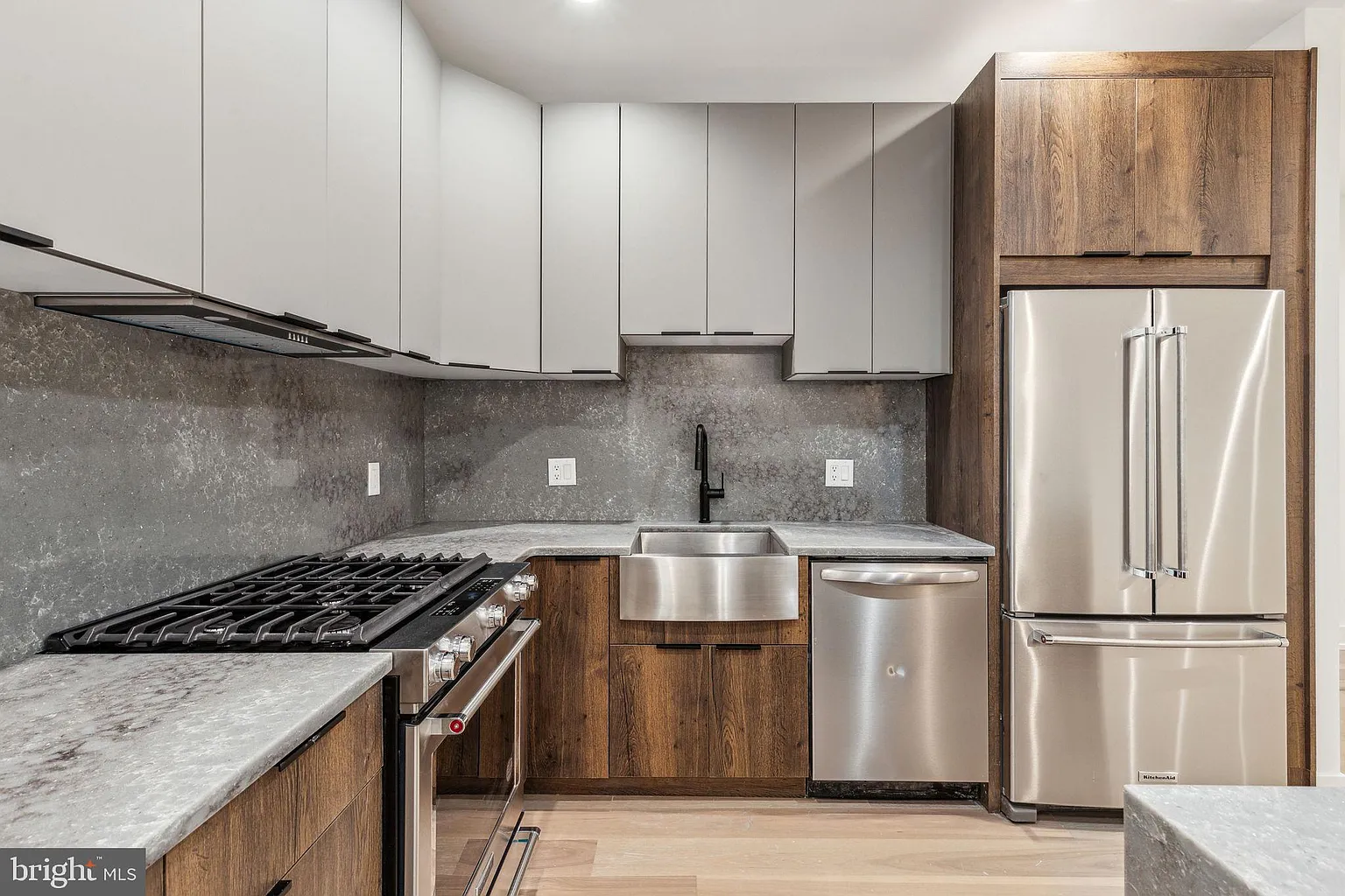 Shaker-style kitchen cabinets in a soft grey finish