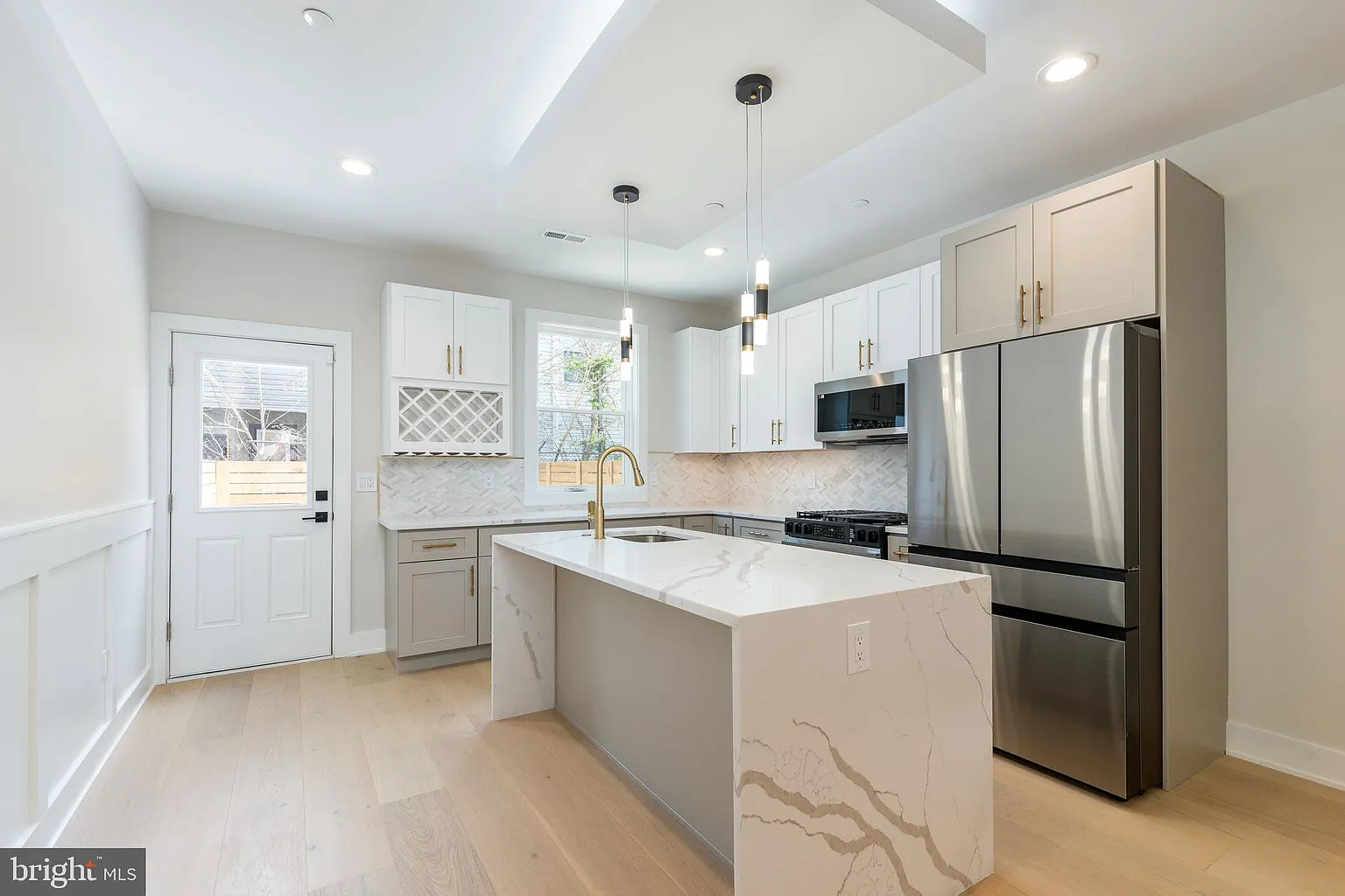 Walk-in shower remodel with natural stone tile