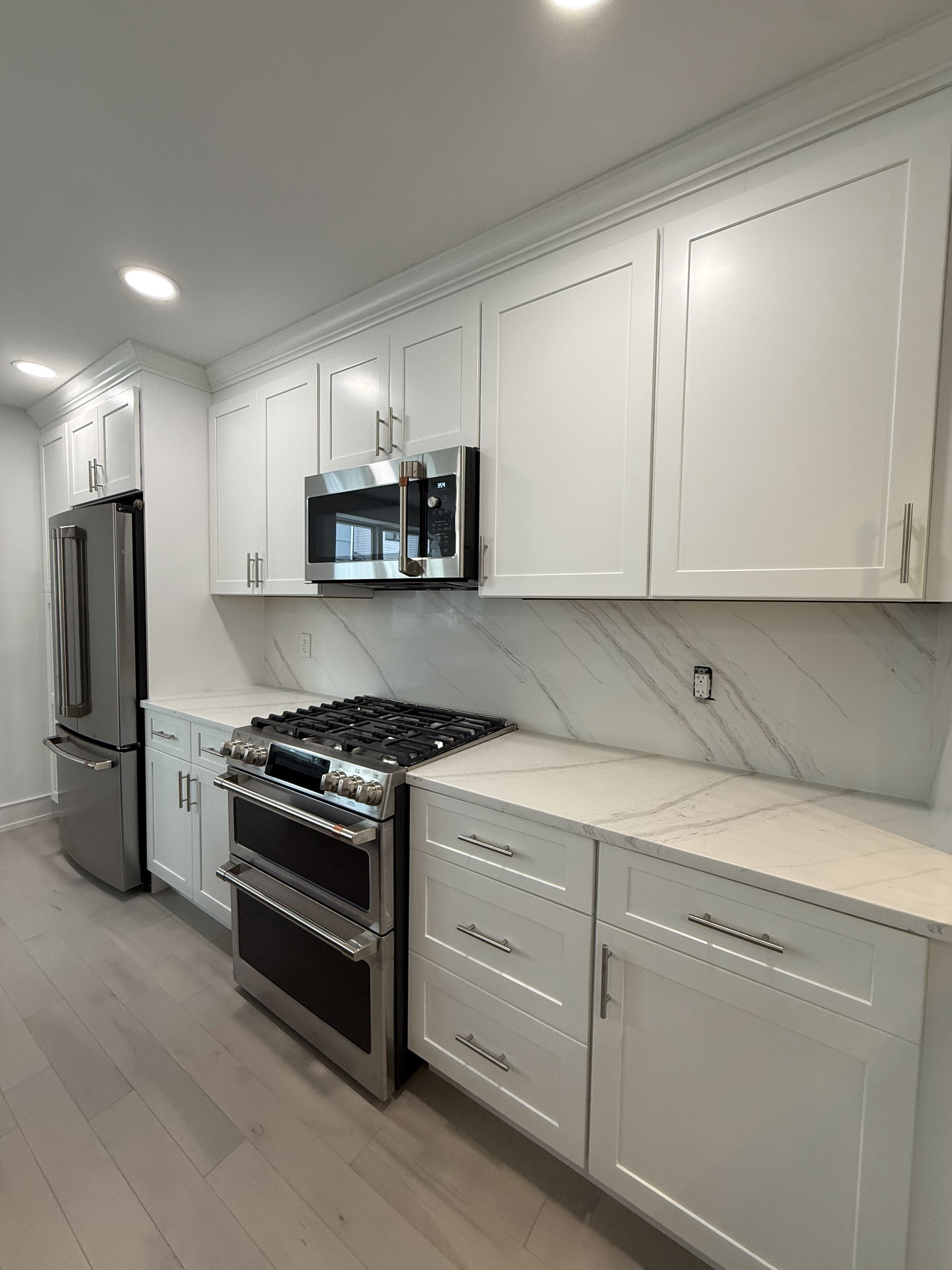 Vertical view of cabinet finishes and stone pairing on display