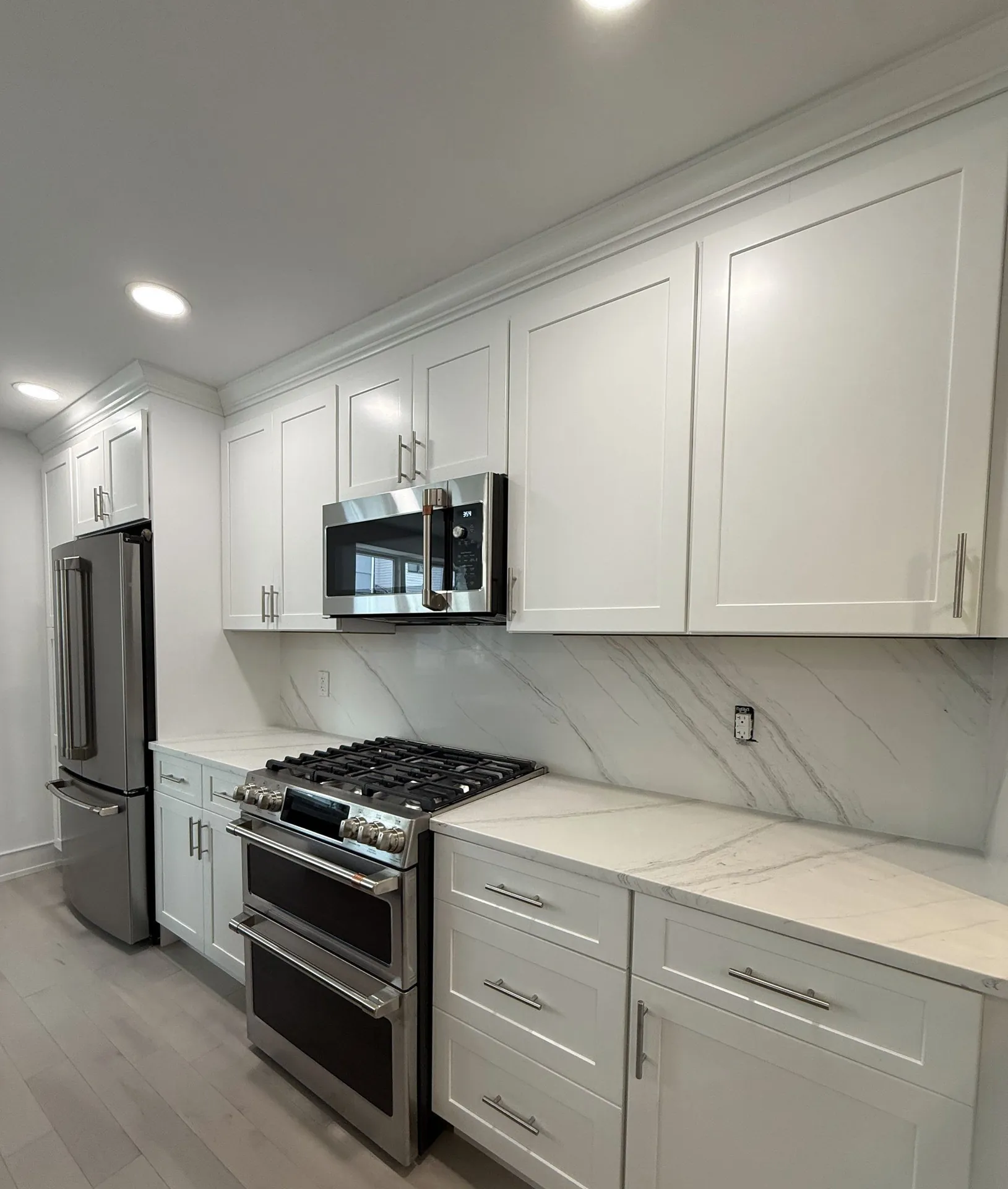 Vertical view of cabinet finishes and stone pairing on display