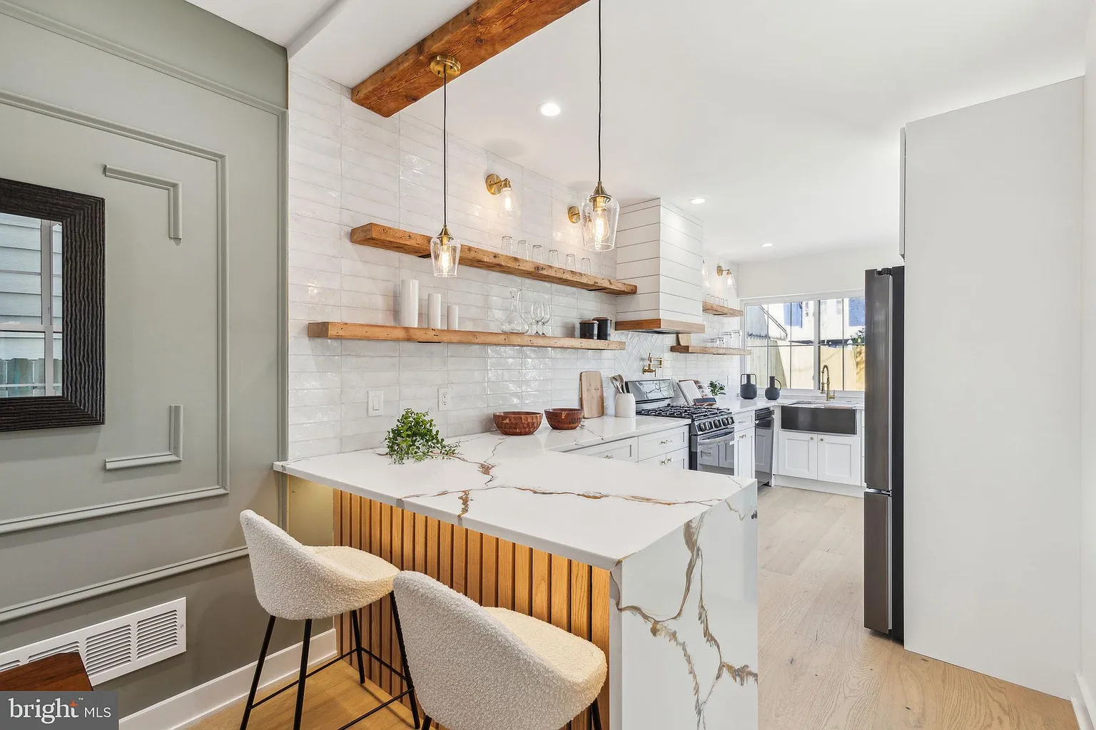 Open-concept kitchen with full-height backsplash