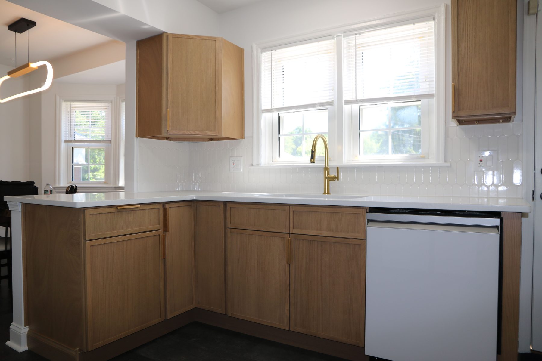 Recently completed kitchen install with light stone countertops