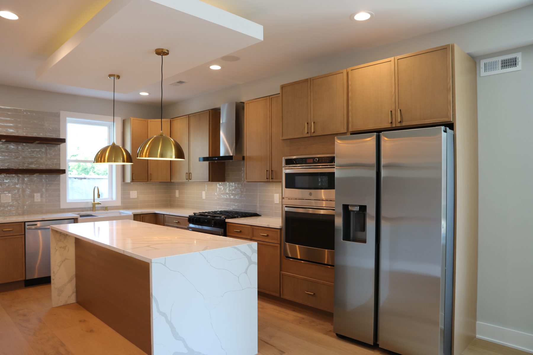 Completed kitchen showing stone countertop seam and edge profile