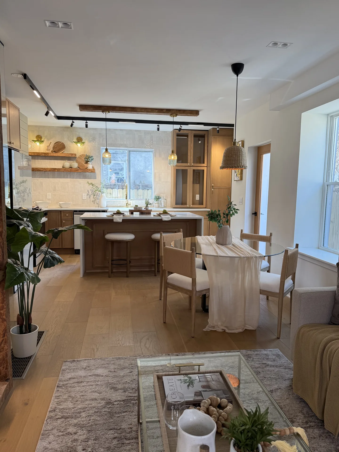 Open-concept loft with custom kitchen island and warm wood cabinetry