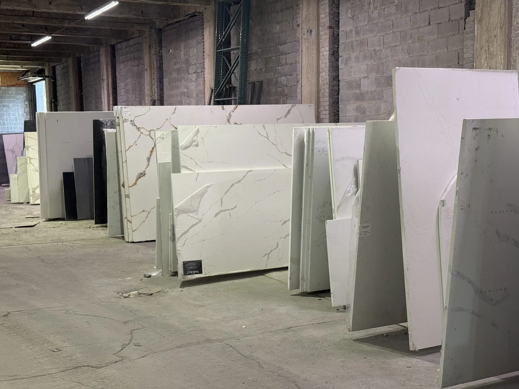 Detail of slabs leaning against warehouse racks