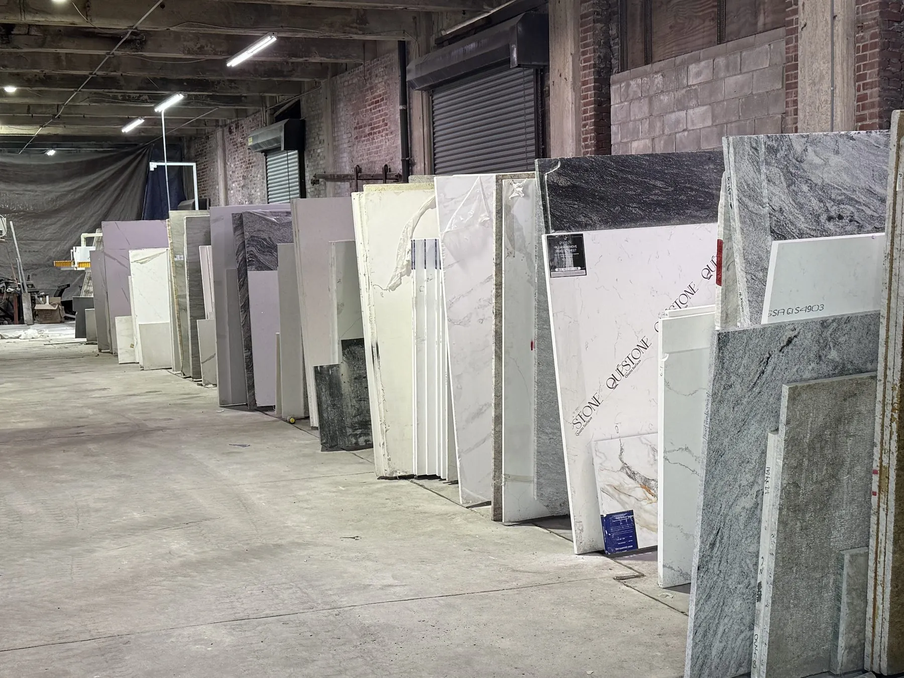 Aisle of full-size stone slabs ready for selection
