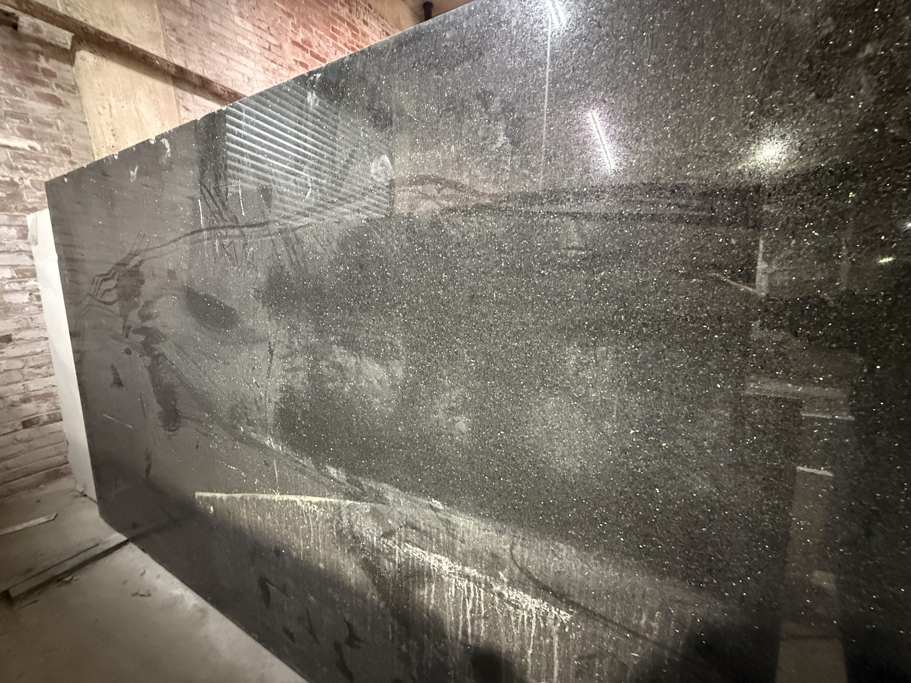 Polished black granite slab close-up
