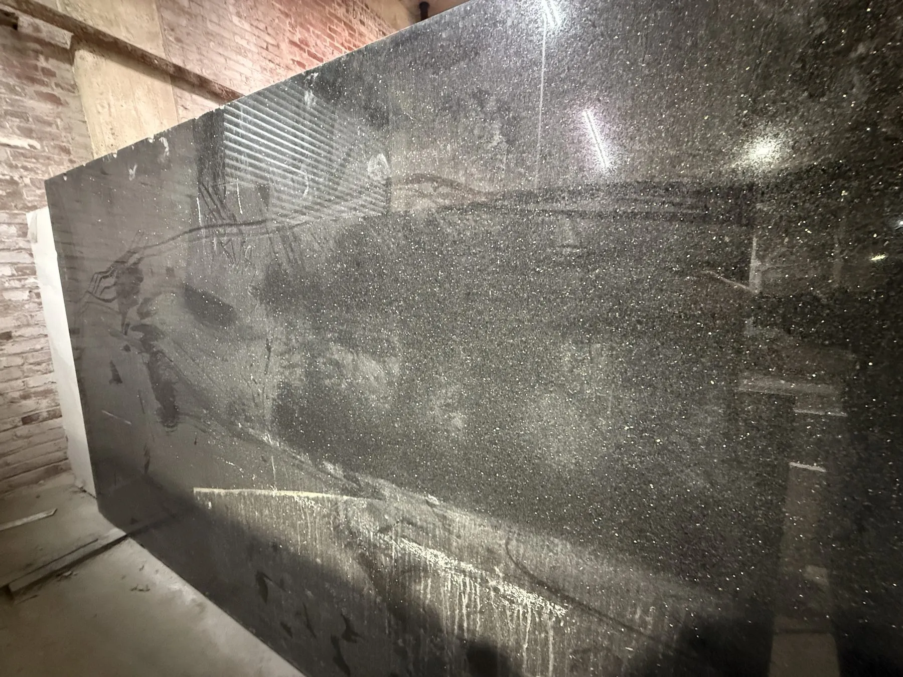 Polished black granite slab close-up